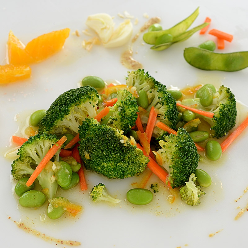 A healthy side dish of broccoli, edamame, and carrots