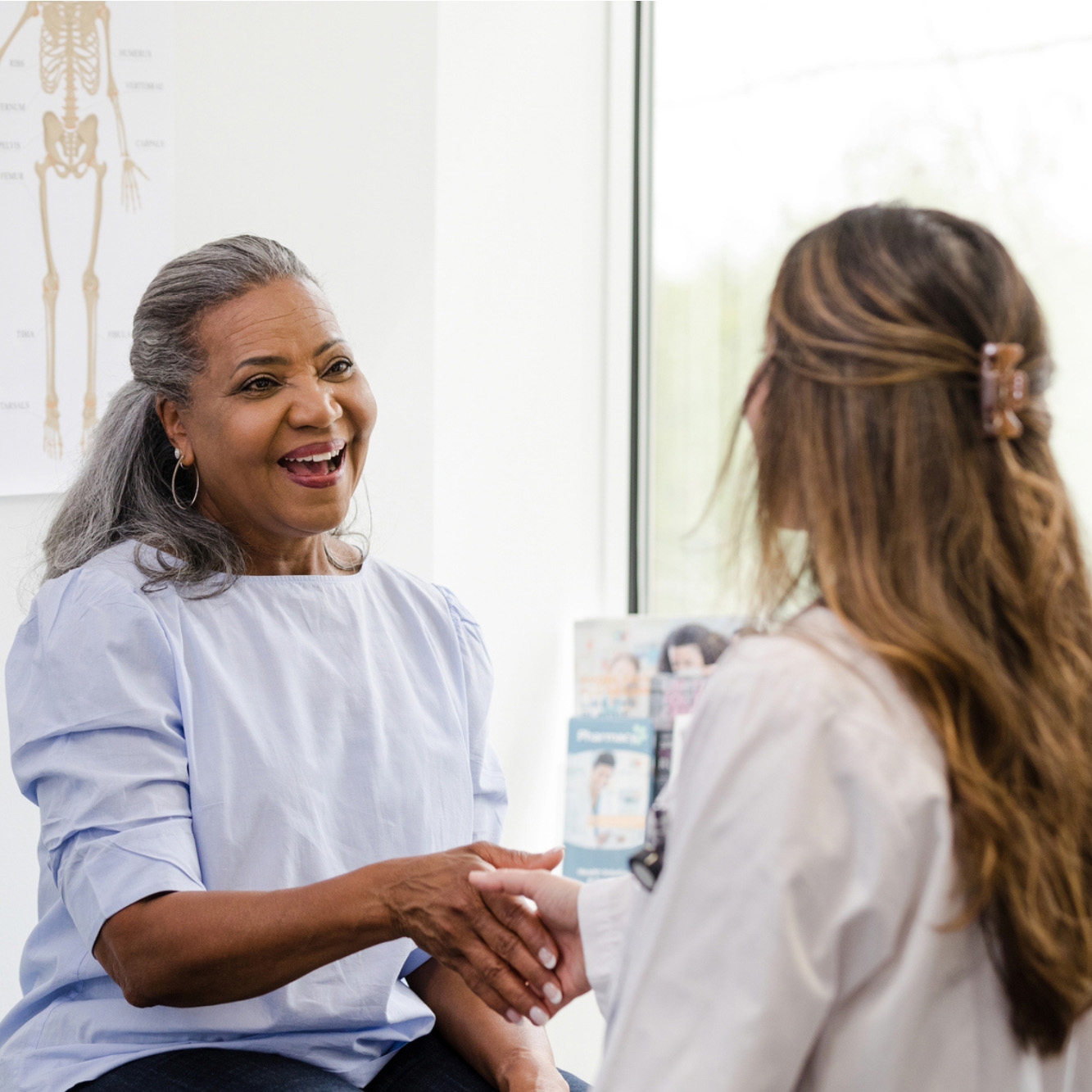 Woman talking with a doctor.